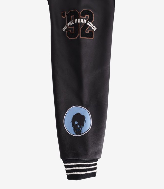 Shop Pleasures x UNKLE Mo' Wax Varsity Jacket Black/White at